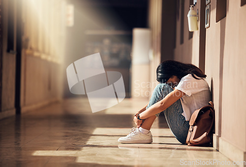 Image of Stress, anxiety and depression of university girl with mental breakdown on campus floor. Frustrated, thinking and depressed indian woman suffering and overwhelmed with burnout at college.