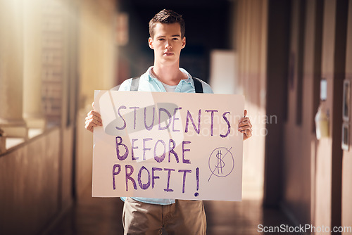 Image of Protest, education and man with poster at university for freedom from student loans, debt and free learning. Justice, equality and student with sign for support at college, school and academic campus