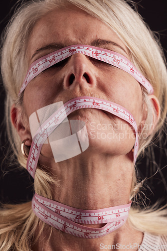 Image of Face, tape measure and woman with anorexia, eating disorder and pain from society body pressure, mental health problem or bulimia. Measuring tape on lady with unhealthy weightloss, problem or anxiety