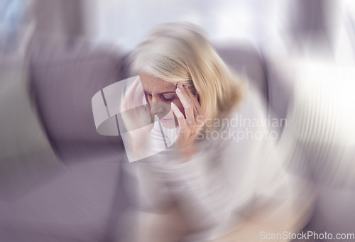 Image of Senior woman, headache and sofa in home with motion blur, pain and depressed while tired in retirement. Elderly, old woman and anxiety with burnout, depression and panic attack on couch at house