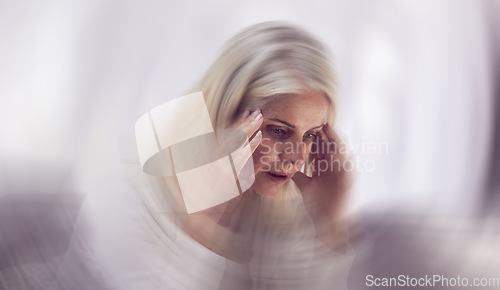 Image of Senior woman, headache and dizzy motion blur on sofa for mental health, stress and health risk. Elderly person, tired and suffering from migraine for dementia crisis or head pain in retirement home