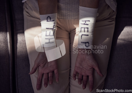 Image of Help, suicide and arm bandage on woman with depression, mental health or anxiety. Top view, closeup and wrist cover of self harm, injury and helping depressed patient stop psychology crisis of trauma