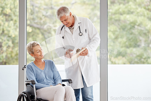 Image of Doctor, consultation and senior patient in wheelchair for healthcare rehabilitation, medical wellness therapy and disability advice in retirement clinic. Hospital, elderly woman and physical therapy