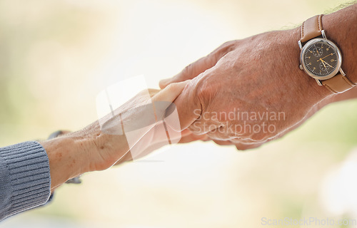 Image of Holding hands, support and trust with senior couple, love and solidarity with helping hands and partnership outdoor. Help, commitment and faith, elderly people with hand holding, together and love.