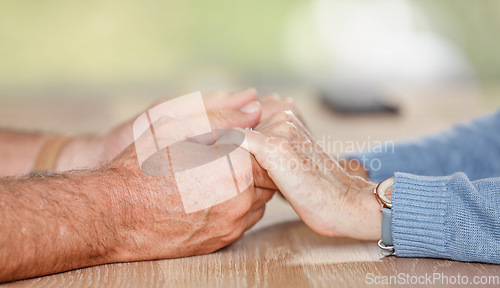 Image of Senior couple holding hands for love, support and trust in retirement, counseling and marriage. Closeup elderly old people, hand holding and hope, empathy or respect, kindness and gratitude with care