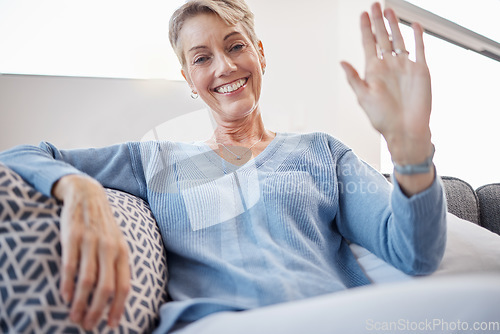 Image of Senior woman, hand or waving on video call pov on sofa in house, home or hotel living room in lockdown communication. Portrait, smile or happy retirement elderly in greeting gesture on social network