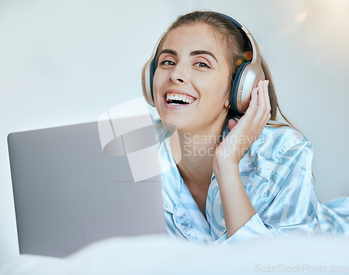 Image of Woman, student and headphones with laptop for music, streaming and learning online with happiness, education podcast and technology. Academic audio, listening portrait and sound, radio and relax.