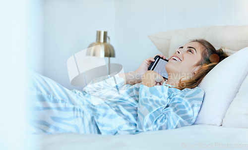 Image of Woman, phone call and bed in the morning, happy and conversation. Female, smartphone and girl in bedroom, talking and smile for weekend break, communication and wifi connectivity to relax and call