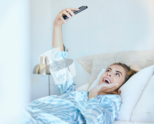 Image of Selfie, girl in bed and photography with phone, technology and memory, smile and happy, young gen z with social media content creation. Happiness in picture, morning and smartphone, wifi 5g network.