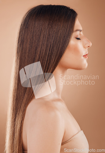 Image of Beauty, hair care and aesthetic woman on studio background for cosmetics, makeup and shampoo product for growth, shine and strong texture. Model with brunette hairstyle for salon or hairdresser ads