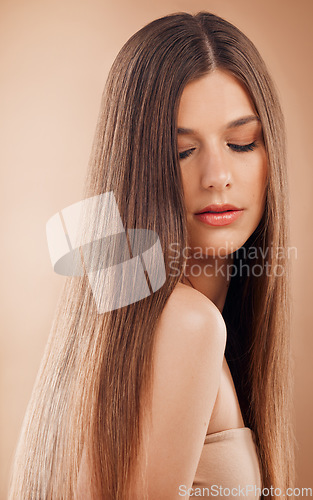 Image of Hair care, beauty and woman on studio background for cosmetics, makeup and shampoo for shine, growth and strong texture hairstyle. Face of brunette posing for hairdresser or luxury salon product