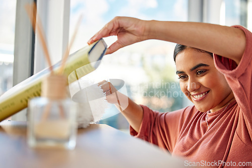 Image of Cleaning, home and woman dusting book shelf to remove dust and dirt. Spring cleaning, cleaning service and happy female cleaner, maid or housekeeper with duster for furniture, chores and hygiene.