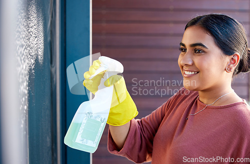 Image of Woman, hands or spray bottle in window cleaning in hotel, home or office building in hygiene maintenance or bacteria housekeeping safety. Cleaner, happy maid or spring cleaning glass doors or product