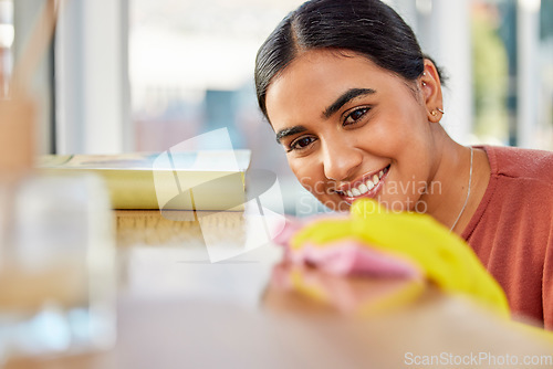 Image of Cleaning, surface and woman with cloth for dirt, dust and bacteria on furniture at home. Happy cleaner, housekeeping and maid wipe table, shelf and living room for routine maintenance, safety or care