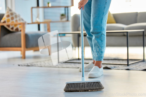 Image of Cleaning, woman with broom and sweeping living room dirty floor and spring cleaning. Housekeeper, cleaner and housekeeping service or home maintenance for fresh, neat and dust free house or apartment