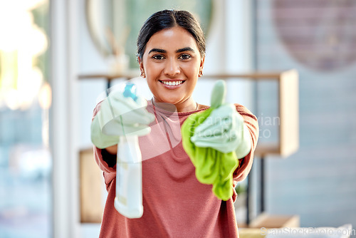 Image of Woman, portrait smile and detergent with cloth for cleaning, hygiene or house disinfection at home. Happy female cleaner smiling holding spray bottle and fabric for disinfect, wash or housework