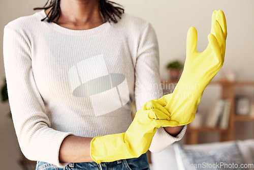 Image of Cleaning, rubber gloves and hands of woman in living room for hygiene, protection and disinfection. Dirt, dust and bacteria with girl cleaner at home for sanitary, housekeeping and domestic chores