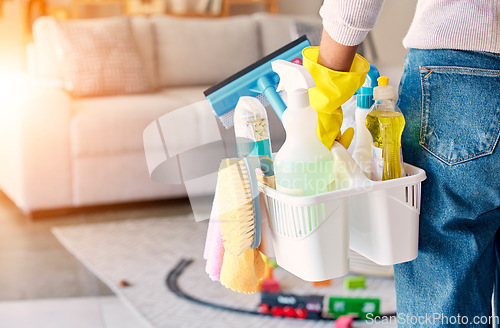 Image of Cleaning, hand and basket of cleaning supplies for family home hygiene with a brush, bottles and gloves. Woman, cleaning supplies and housekeeper about to clean a home for spring cleaning