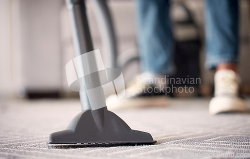 Image of Floor, house or vacuum cleaning carpet or dusty, messy or dirty bacteria on ground in spring cleaning. Cleaning services, home or worker with an electrical vacuum cleaner for living room rug or mat