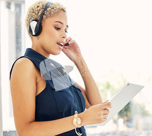 Image of Call center, customer service and black woman on tablet consulting in office. Crm operator, contact us and female customer support worker, sales agent or consultant with touchscreen for telemarketing