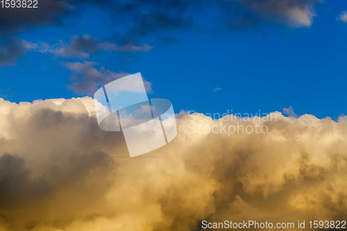 Image of yellow bright the clouds during sunset