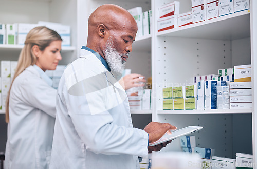 Image of Pharmacy, stock and digital tablet for inventory by man and woman checking medicine and packing shelves. Pharmacist, senior man and online search on device app for information, prescription and pills