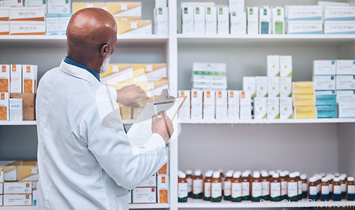 Image of Pharmacy, senior man and checklist clipboard for stock, inventory and pills, prescription and checking. Pharmacist, writing and black man counting medical product, medicine and treatment for record