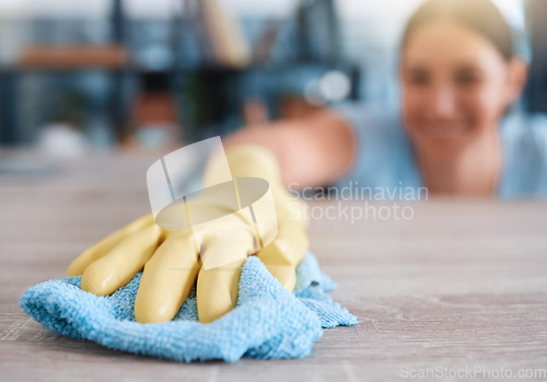 Image of Hand, woman and table cleaning for hygiene, housework and household cleansing in an apartment. Hands, girl and clean product for dust, dirt and germs, bacteria and illness prevention on surface