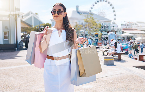 Image of Sunglasses, woman outdoor and shopping for boutique fashion, expensive products and client retail. Female customer and girl with eyewear, purchase clothes and consumer in city, items in bag or luxury
