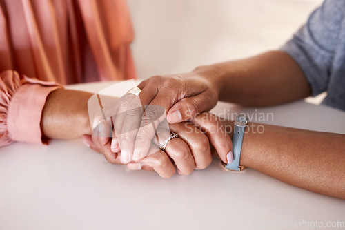 Image of Hands, women and holding closeup in support of comfort, empathy and unity in crisis, cancer or bad news. Hand, zoom and friends holding hands for hope, trust and prayer for girl suffering depression