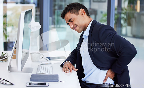 Image of Back pain, business man and stress of a office consultant with burnout and anxiety at desk. Computer, businessman and working strain from a risk management worker looking for back support online