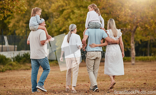 Image of Big family, walking and relax together in nature park for summer vacation, holiday enviroment and sunshine outdoor. Grandparents, parents and children walk for quality time or bonding for happiness