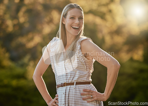 Image of Portrait, happy and woman relax in park, smile and cheerful while walking in nature, fresh air and joy. Face, girl and adventure in forest, excited and having fun, pose and laugh on bokeh background