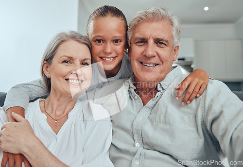 Image of Love, family and portrait by girl and grandparents on sofa for bond, hug and quality time in their home together. Happy family, face and senior man with woman relax with grandchild while babysitting