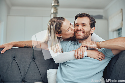 Image of Love, couple and sofa kiss portrait in home for care, gratitude and intimate moment in home. Happy people in marriage bonding together in living room with romantic embrace with hug and smile.