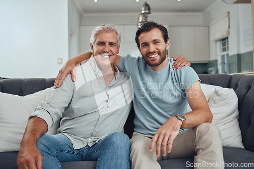 Image of Portrait of a senior man with his adult son relaxing on a sofa together in the living room. Happy, smile and elderly male pensioner in retirement sitting and bonding with a young guy in family home.