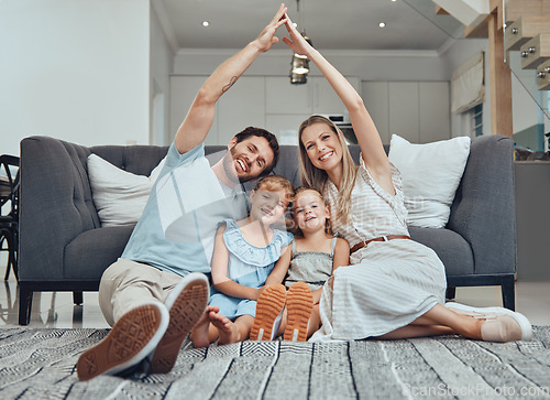 Image of Family home, portrait and roof hands with smile, parents and happiness by sofa in living room together. Young happy family, kids and floor with love, bonding and care on lounge carpet in Los Angeles
