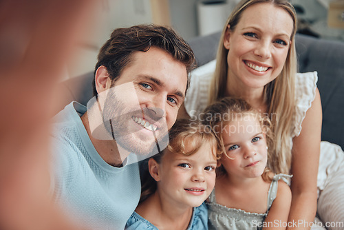 Image of Family, selfie and home of a mother, dad and girl children on a living room sofa with love and care. Parents, kids and mama with father on a couch with a happy smile bonding together in a lounge