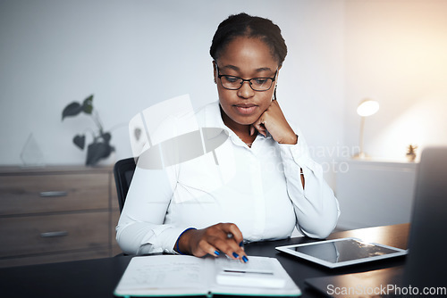 Image of Business, accounting calculator and black woman typing in office working late calculating financial budget. Planning, night and female accountant, employee or worker doing bookkeeping in workplace.