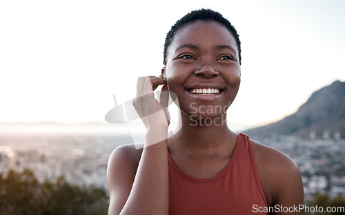 Image of Music, fitness and running with a sports black woman outdoor in nature for a workout or exercise. Health, wellness and training with a female runner or athlete outside for cardio or endurance