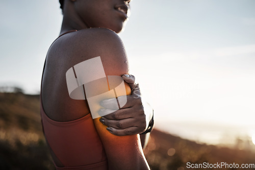 Image of Black woman, arm pain and exercise injury after training accident outdoors. Sports, fitness and female athlete with fibromyalgia, inflammation or sore muscles after cardio workout, running or jog.