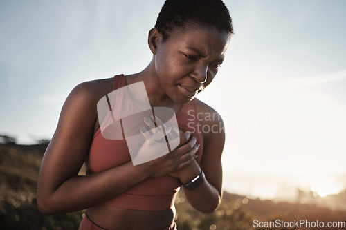 Image of Black woman, runner and heart attack pain in nature while running outdoors. Sports, cardiovascular emergency and female athlete with chest pain, stroke or cardiac arrest after intense cardio workout.