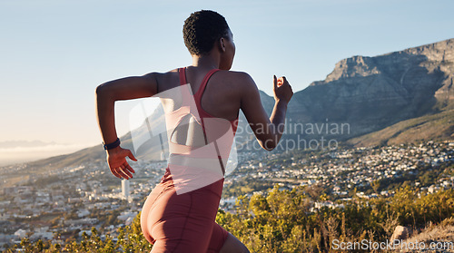 Image of Back, black woman and running in nature, workout and training for wellness, health and fitness. African American female, trainer and runner outdoor, practice for marathon and exercise for cardio.