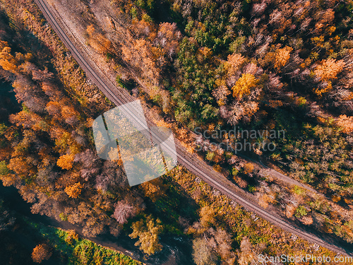 Image of Aerial view of autumn countryside with railway