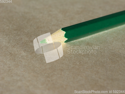 Image of Green pencil over paper