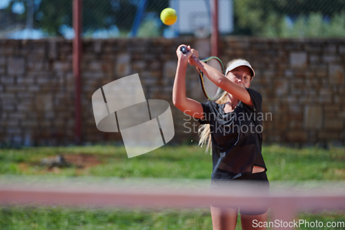 Image of A young girl showing professional tennis skills in a competitive match on a sunny day, surrounded by the modern aesthetics of a tennis court.