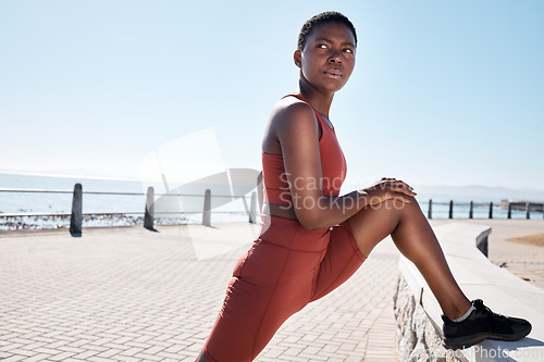 Image of Stretching, legs and black woman on the promenade for fitness start, cardio motivation and exercise in Costa Rica. Warm up, sport and African runner training for sports competition and workout