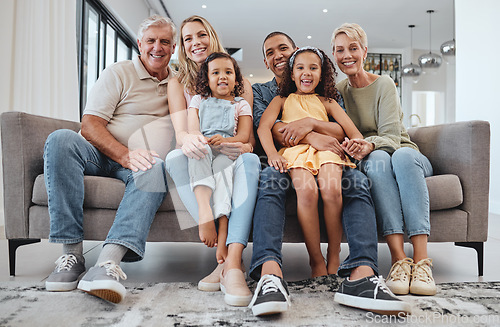 Image of Love, interracial and family on sofa, grandparents and children relax, portrait and happy together. Grandmother, grandfather and girls with mother, father and bonding in living room, smile or weekend