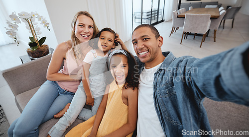 Image of Family selfie, children and portrait on living room sofa for bonding, happiness or love on social media. Interracial happy family, digital picture or smile together on social network in San Francisco