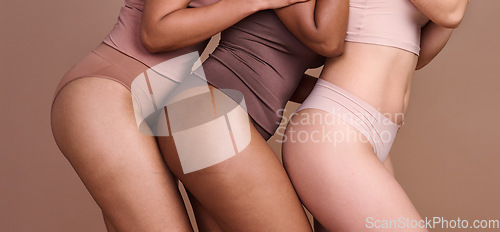 Image of Legs, skincare and diversity of body positive women, natural beauty and wellness on studio. Group, models and thighs together in underwear for laser cosmetics, healthy glow or aesthetics of self care
